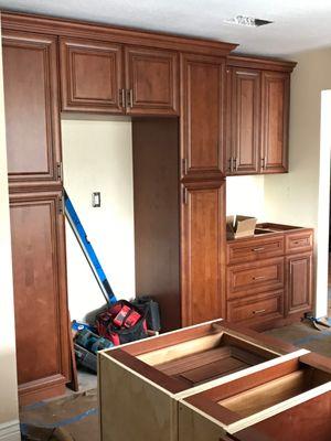 Installing the cabinets.