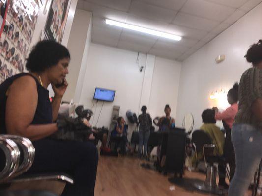 Inside the salon in the back of the beauty supply store.