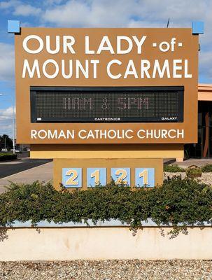 The sign in front of the Church - view from the road.