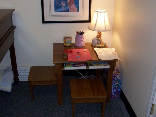 A craft and coloring area for children in my office.