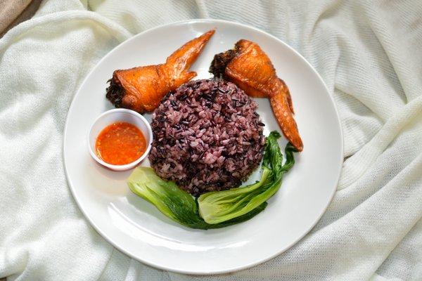 Sticky rice, stuffed wings (3), veggie side, and sauce of choice.