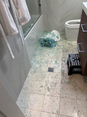 Photo of broken glass shower door