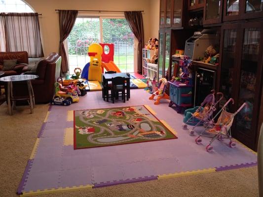 Children's play area fully visible from the kitchen and dining area.