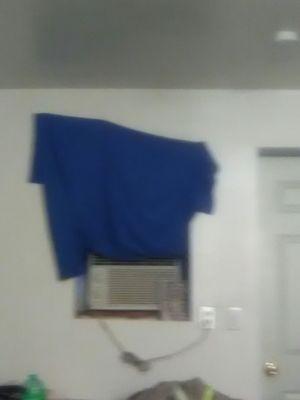 No curtain, no blinds, window covered with a towel and push pins. The air conditioner was filthy and doesnt cool, only has fan.