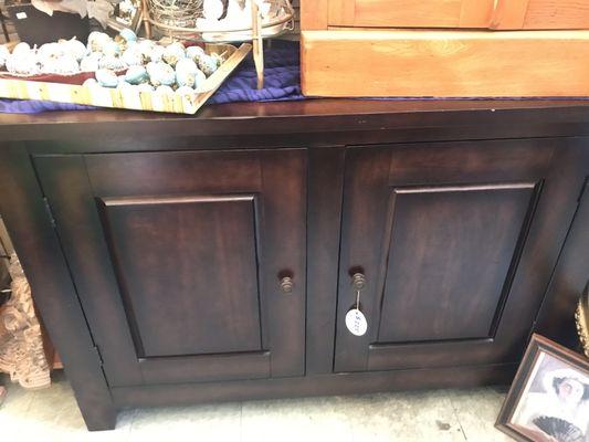 Buffet with a wine rack inside