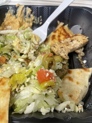 Chicken platter with salad, pita, and hummus.