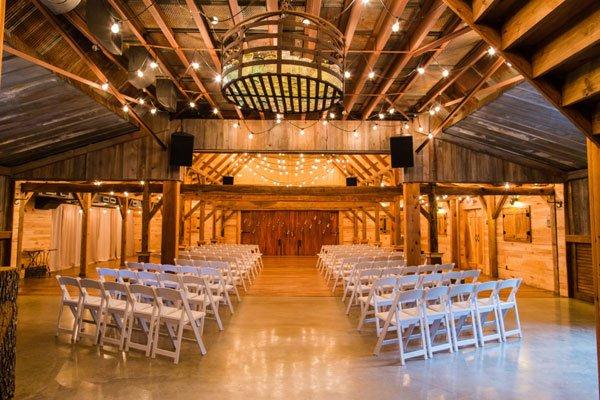 Indoor barn wedding ceremony