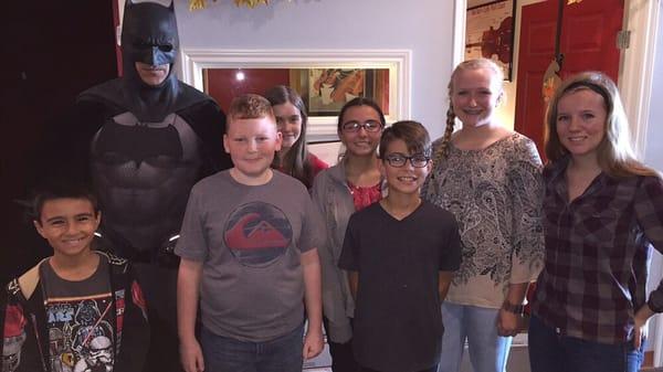 Students standing with The Batman of San Antonio after a wonderful donation drive of non-perishable goods to be sent to our troops overseas.