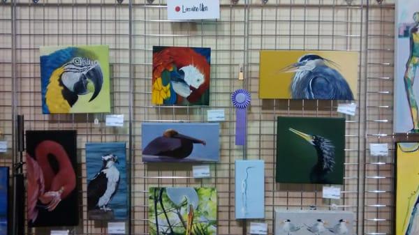 One of the artists, Lerraine Ullen, features Florida birds. Other artists do portraiture, abstract art, and other styles.