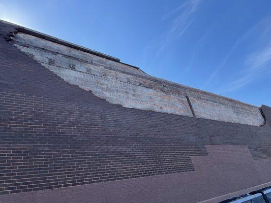 Part of the wall was brought down during a wind storm.