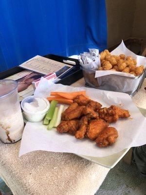 Wings and basket of tater tots