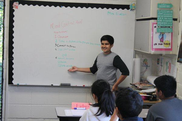 Public Speaking - Student delivers a speech showing excellent hand gestures.