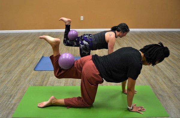 Pilates style fitness - mat Pilates with balls