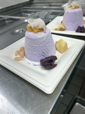 Halo Halo  Tarp snow topped with condensed milk, flan, macapuno coconut, ube paste, sweetened red and white beans, and jackfruit