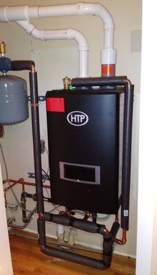 HTP wall hung natural gas High Efficiency boiler and domestic hot water. Never run out of hot water again