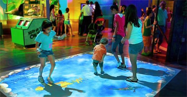 Kids playing EyeClick at a museum