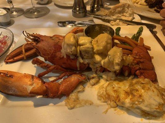 Lobster stuffed with scallops and shrimp.