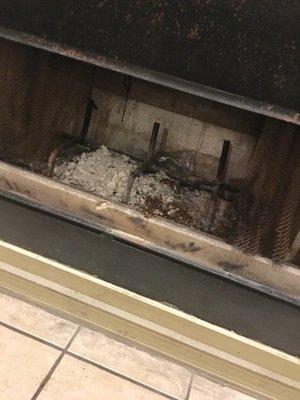 Used and filthy fireplace.