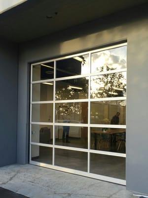 GLASS ALUMINUM SECTIONAL COMMERCIAL DOOR