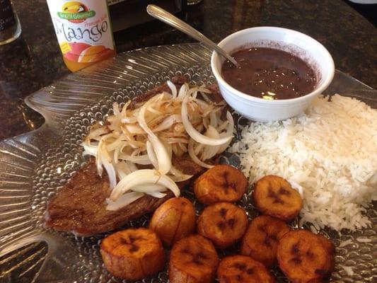 Steak with onions, black beans, rice and sweet plaintains. Yum.