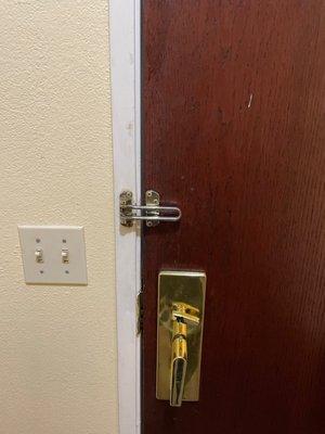 Broken extra lock on door along with more stains