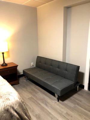 Single room with a futon. Seating or extra sleeping option.