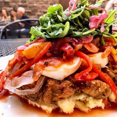 Veal, polenta, prosciutto, mozzarella, peppers, pickled onions, and arugula