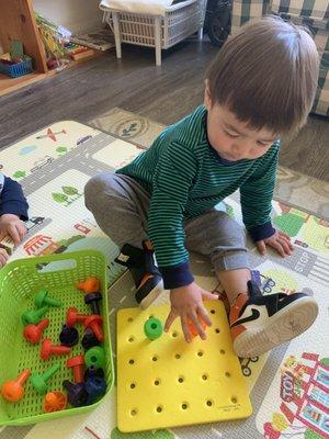 Sorting out pegs by 1.5yr- old