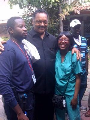 Dr. Moore in Haiti after the earthquake, with Rev. Jessie Jackson.