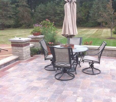 Brick pavers and seat wall.