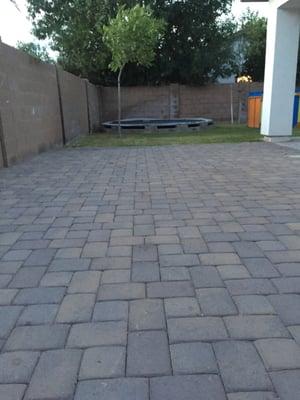 Backyard pavers and underground trampoline.