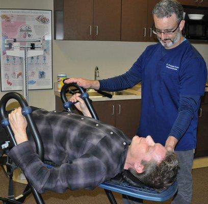 Controlled Inversion helps alleviate back pain using decompression.