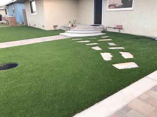 American made Pinehurst turf, Orco pavers, 6' tall cinderblock wall and split face decorative pillars installed in Anaheim.