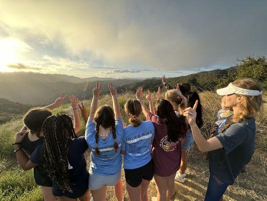 A kids sports team celebrating with a team-building hike! We create the best group hiking activities for team, private, or corporate events!