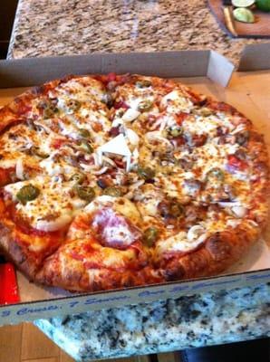 Brewer's combo: pepperoni, salami, sausage, onion, jalapeño, and cashews on a beer batter crust.