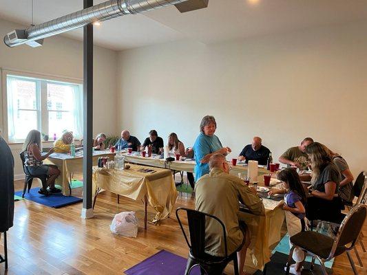 Students got to do yoga, then have a guided painting lesson. Students brought wine and snacks.