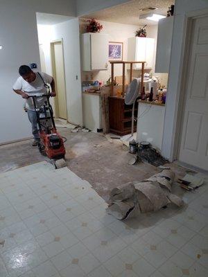 remodeling a residential house, removing old vinyl off floor