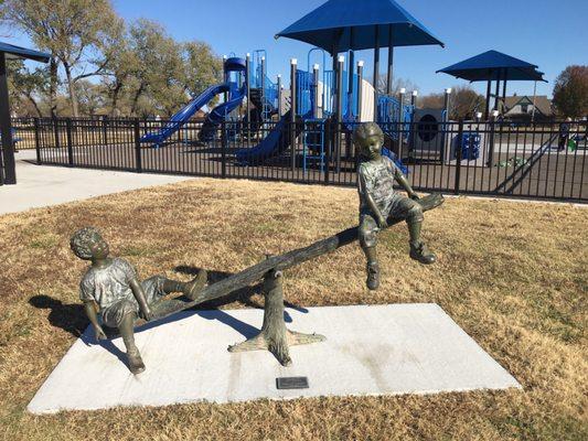 The see saw works on this Timmy and Cindy statue at the park. The pair appear in different situations throughout Owasso.