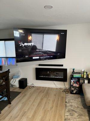 -65in TV with swivel mount, sound bar and floating fireplace installation