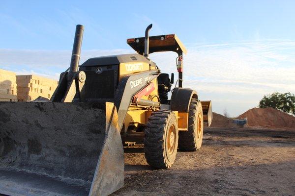 Tractor used to provide one yard scoop of material