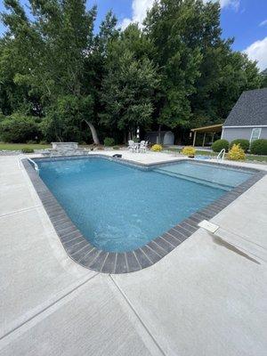 In ground vinyl pool "L" with tanning ledge and water fall