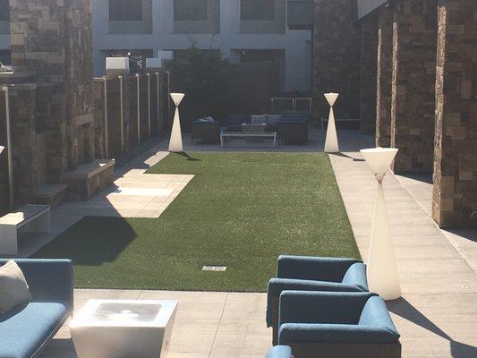 This hotel amenity court is usable year round with landscape grass by ForeverLawn.