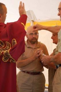 Laying on hands blessing into ministry.