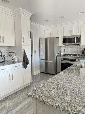 Update: Just had floors replaced. Love how it really pulls together the two color cabinets.