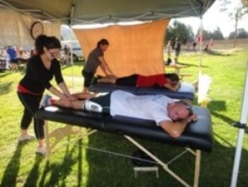 Giving massage at a sports event.