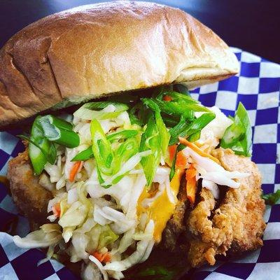 The Pork Tonkatsu Sammich. Panko crusted Fried Pork w/ Green Apple Slices, Siam Slaw, Green Onions and our famous Wang Sauce(TM)