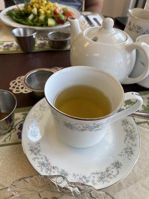 Proper tea in delicate cups. Tea is served loose leaf in the pot to properly steep. After 3-5 mins pour through individual strainer