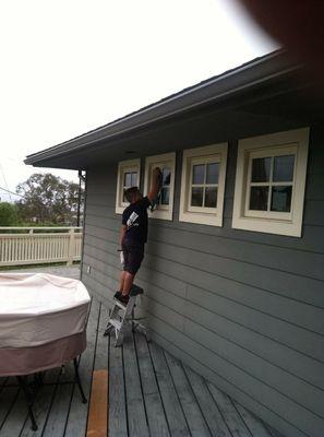 Joe cleaning windows