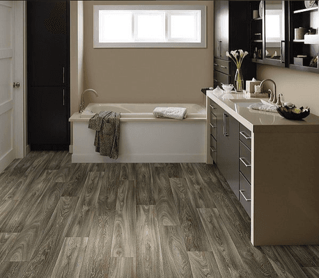 Waterproof vinyl flooring that features incredibly realistic wood designs.