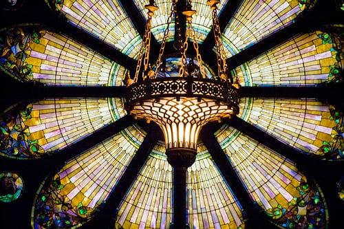 The magnificent side window designs were signed by Tiffany Studios.